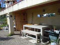 Terrasse couverte avec accès au sous-sol